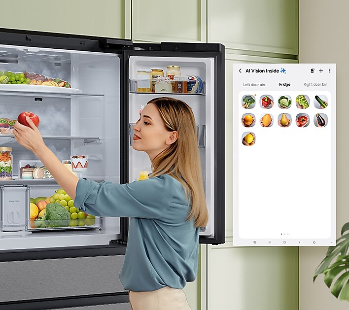 Person grabbing an apple from open 4-Door French Door Fridge