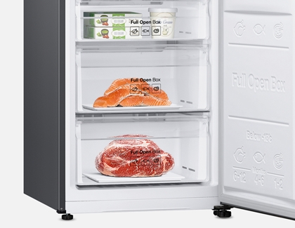 Meats being stored in the bottom shelf